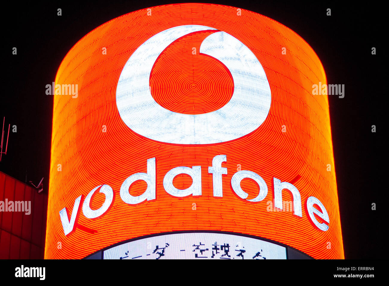 Japan, Tokyo, Ginza. 4chome Intersection, San'ai building, night. Famous landmark. Neon sign