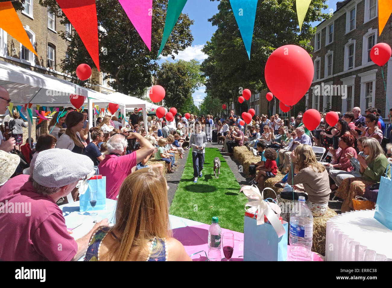 Islington, London, 7 June 2015. A gloriously sunny day at the Big Lunch Street Party in Englefield Road, with the overall winner of the dog show competition parading for the judges. Credit:  Carolyn Clarke/Alamy Live News Stock Photo