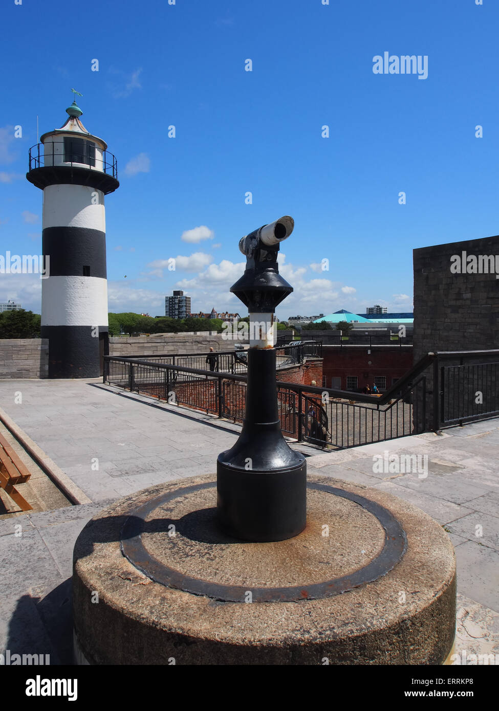 A black and white telescope and Black and white lighthouse at Southsea Castle, Portsmouth, England Stock Photo