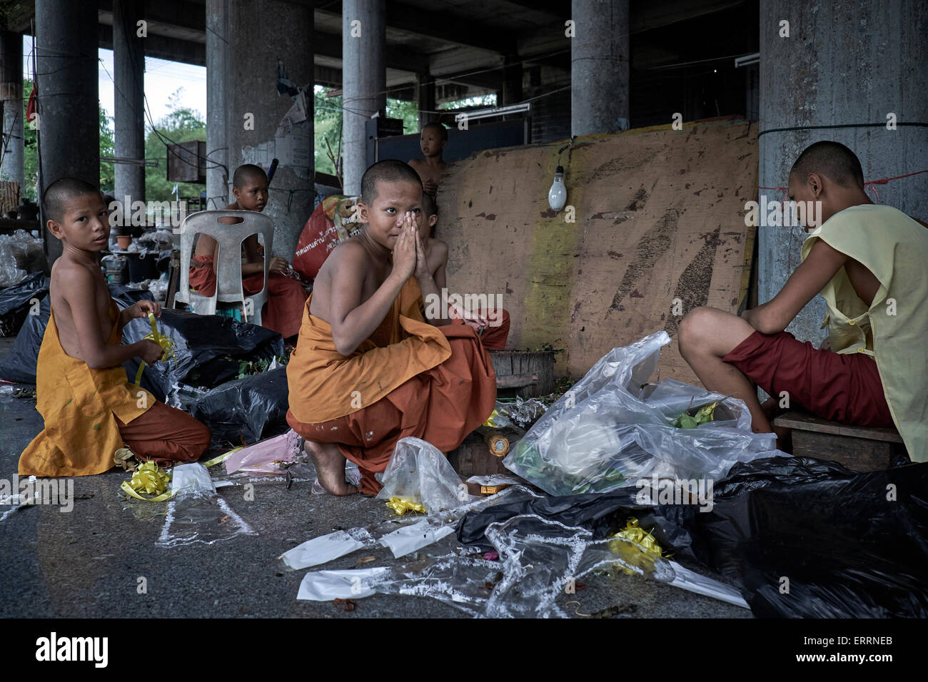 Thailand monk. Boy monks cleaning rubbish at a Thai temple. Thailand S. E. Asia Stock Photo