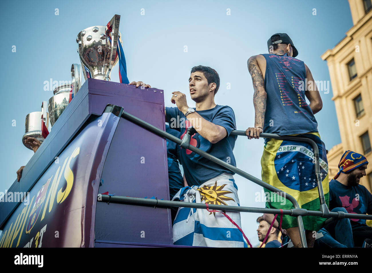 Barcelona, Catalonia, Spain. 7th June, 2015. FC Barcelona's centre-back GERARD PIQUE stands behind the trophies on the top deck of an open-topped bus during the triple victory parade through Barcelona to celebrate the 2nd 'triple' in the clubs history Credit:  Matthias Oesterle/ZUMA Wire/ZUMAPRESS.com/Alamy Live News Stock Photo
