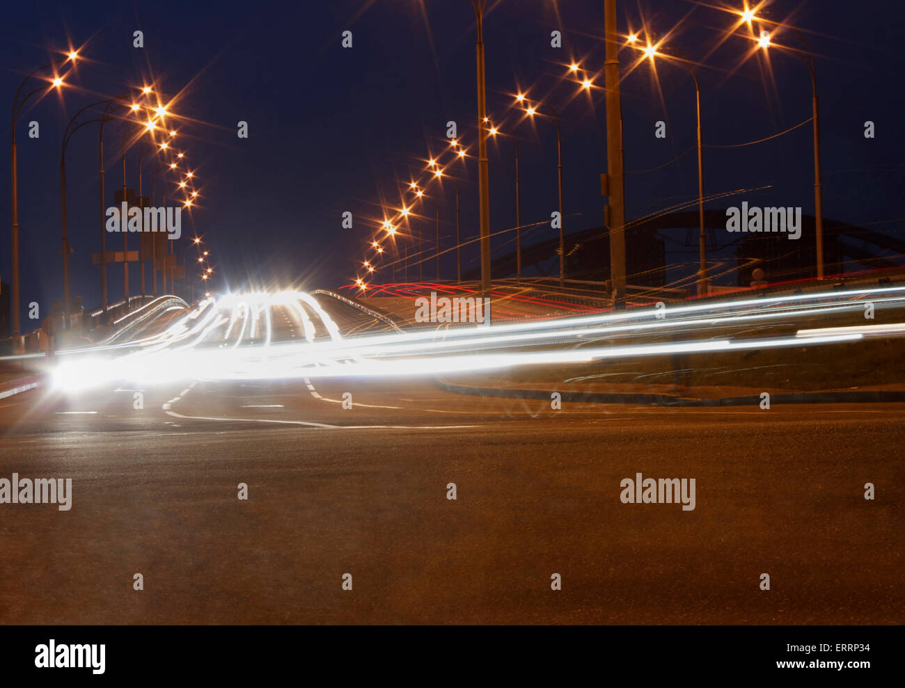 traffic movement on bridge in Kyiv at night Stock Photo