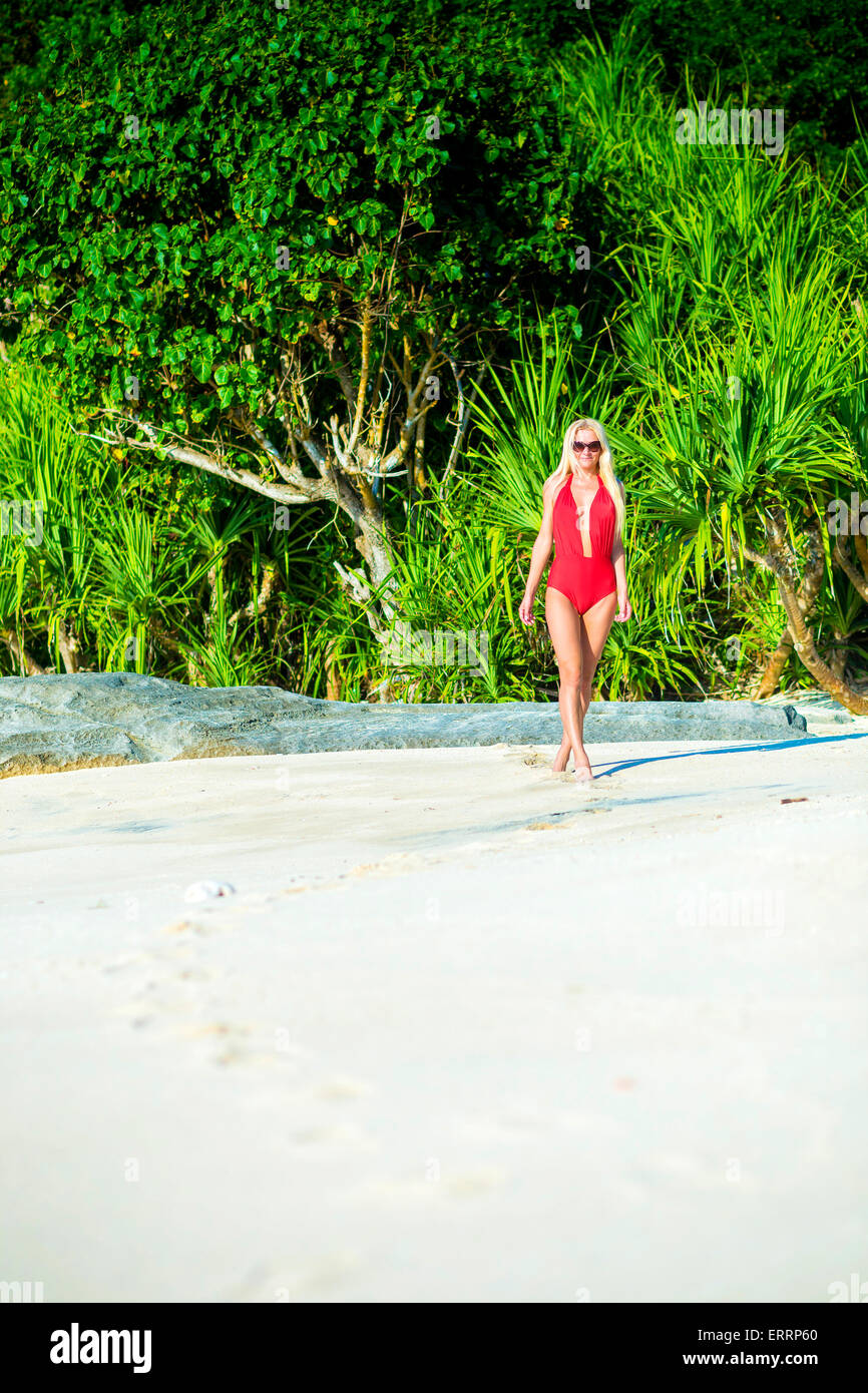 Young woman in bikini on a beach. Stock Photo
