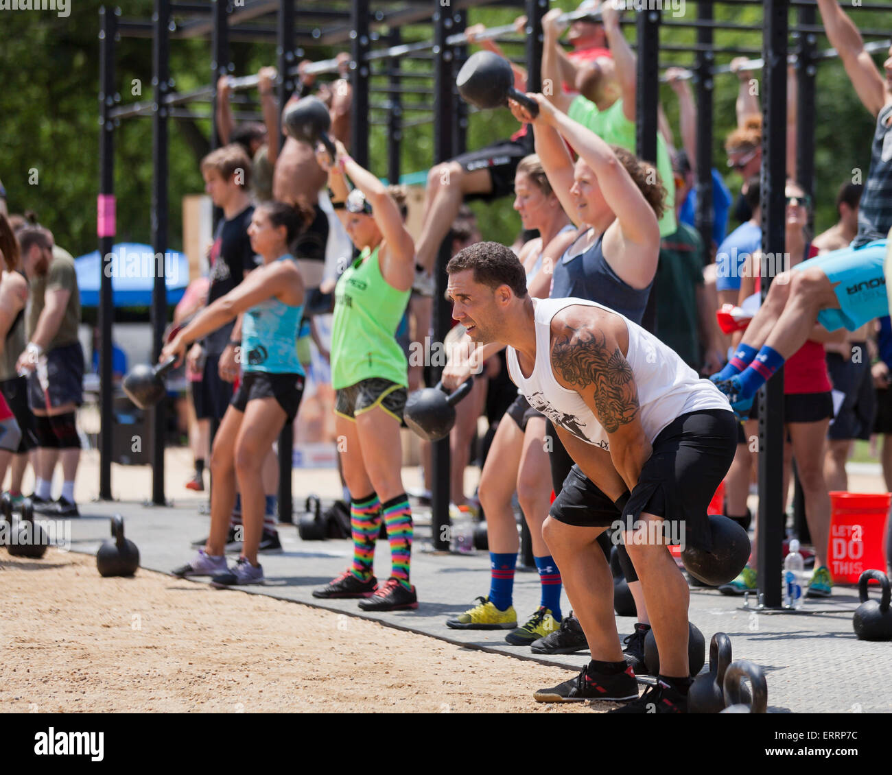 Crossfit trainees performing kettlebell lifts - USA Stock Photo