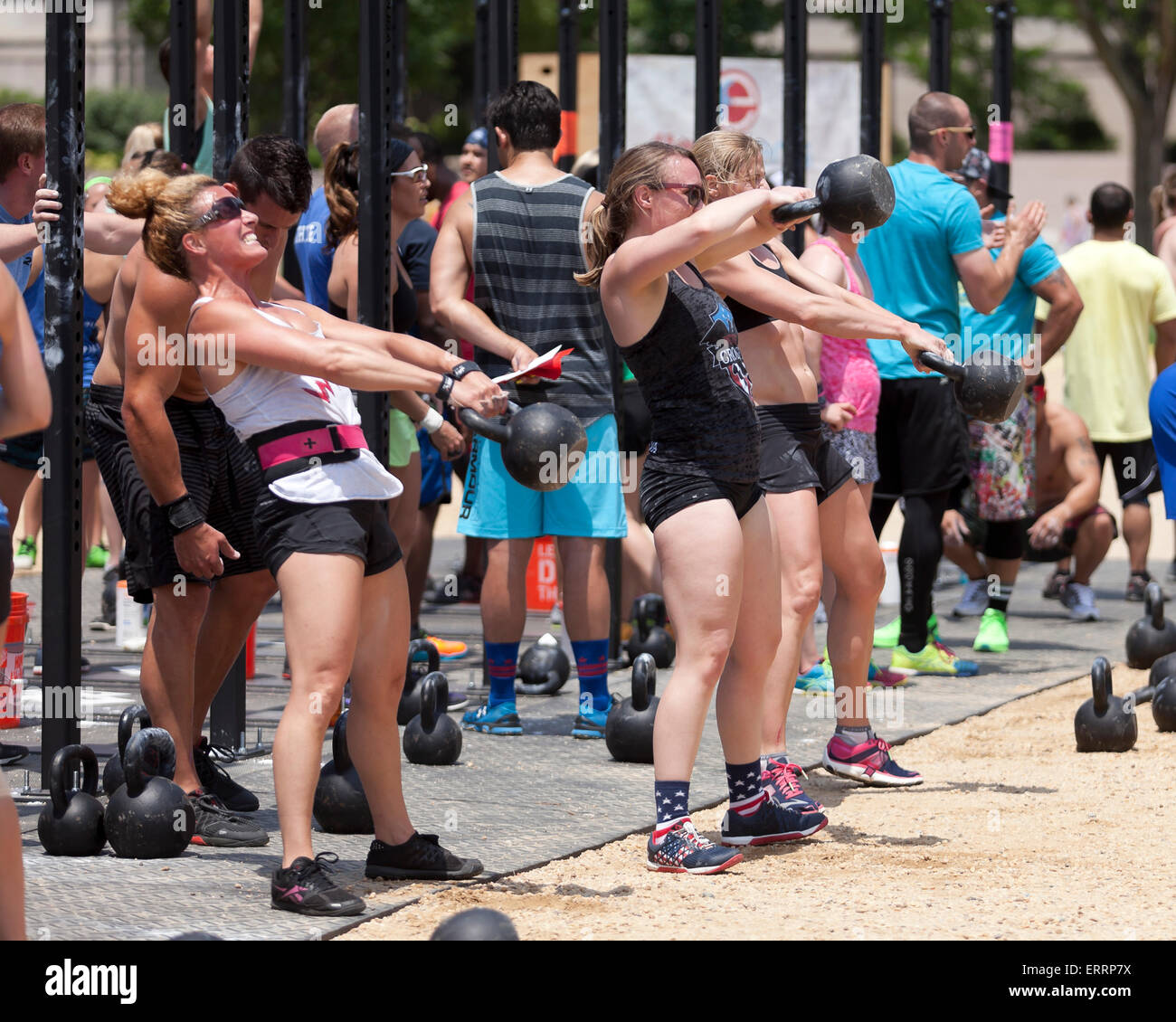 Crossfit trainees performing kettlebell lifts - USA Stock Photo