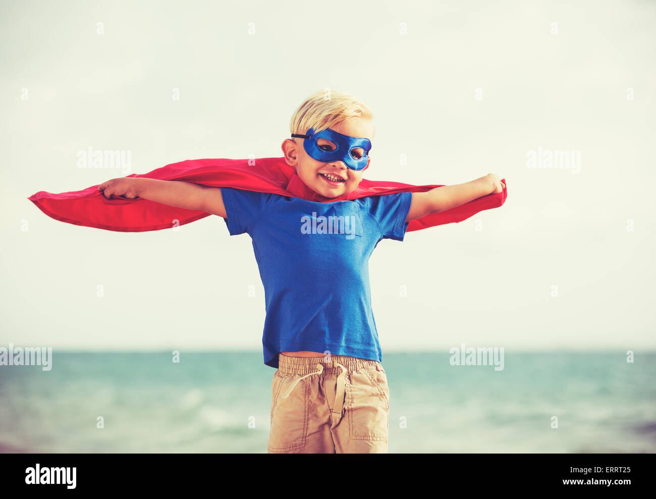 Superhero Kid, Young Happy Boy Playing Stock Photo