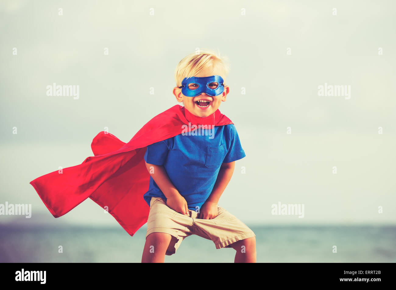 Superhero Kid, Young Happy Boy Playing Stock Photo