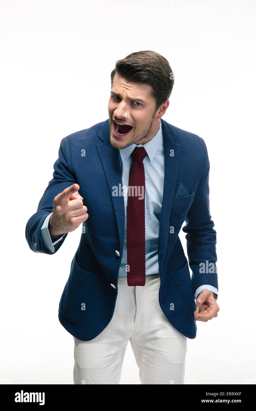 Angry businessman screaming nad pointing finger at camera. Isolated on a white background Stock Photo