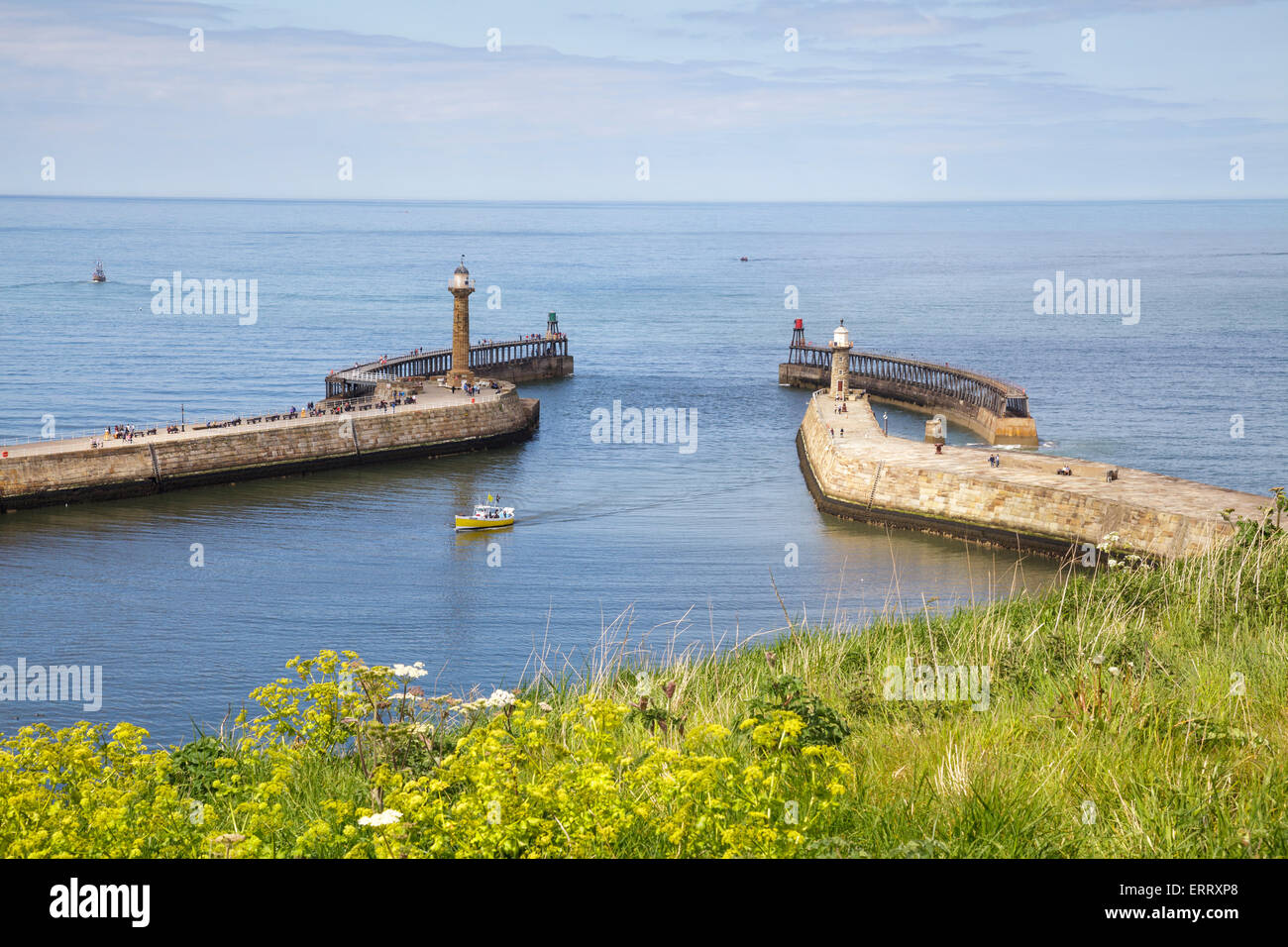 entrance to Whitby Harbour with lighthouses, Yorkshire, England Stock Photo
