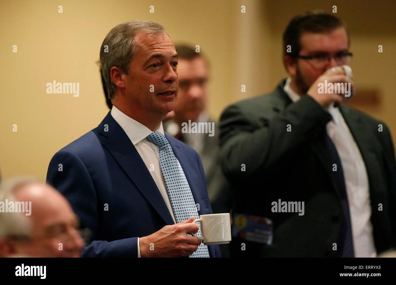 UK Independent Party leader Nigel Farage has a cup of tea whilst watching Mark Reckless speech during UKIP South East Conference 2015 at the Winter Gardens in Eastbourne June 6 2015 Stock Photo