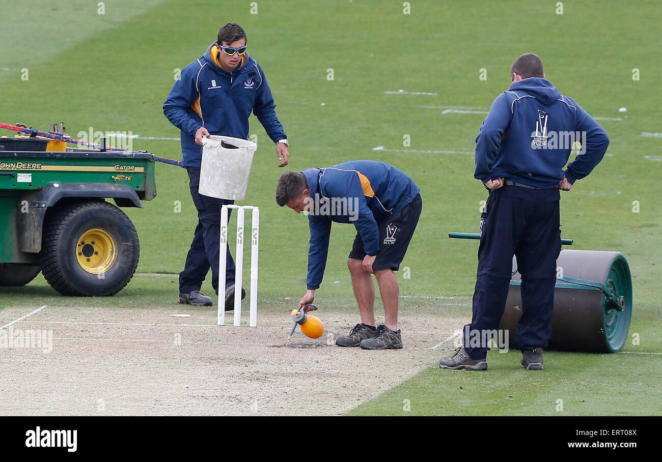 A groundsman and his team prepare a cricket wicket Stock Photo Alamy