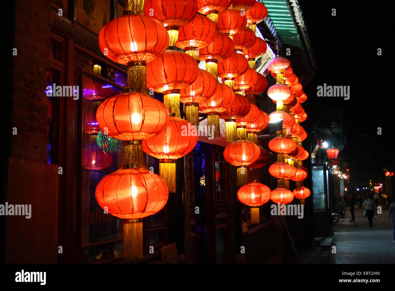 Bright night lights of the ancient Chinese city of Pingyao. China Stock Photo