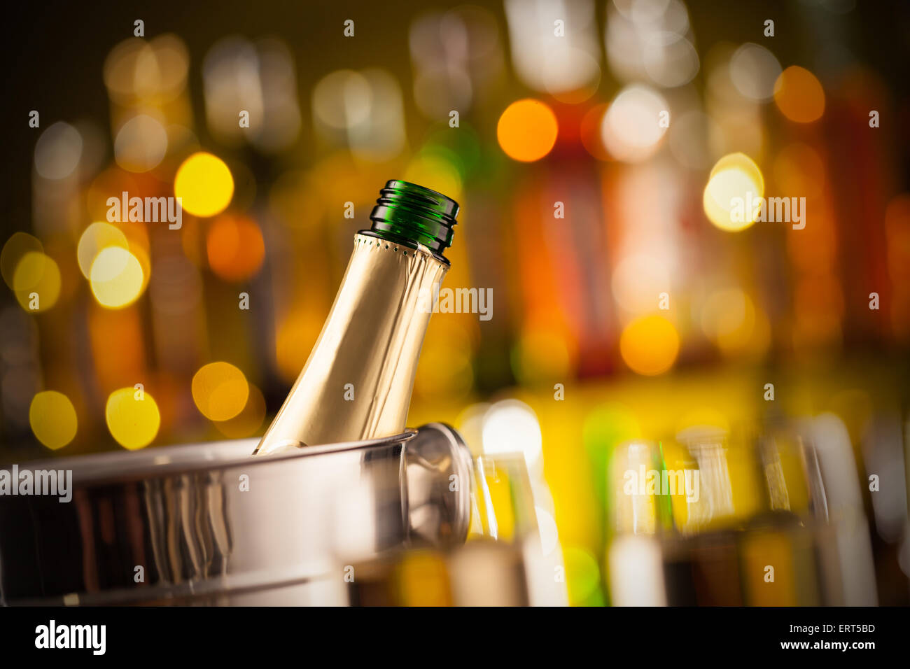 Concept of celebration. Opened bottle of champagne in metal container Stock Photo