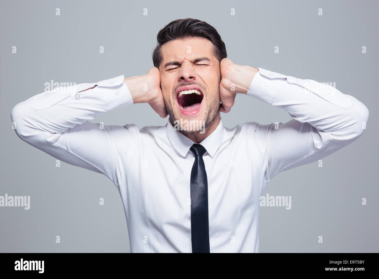 Man covering ears screaming hires stock photography and images Alamy
