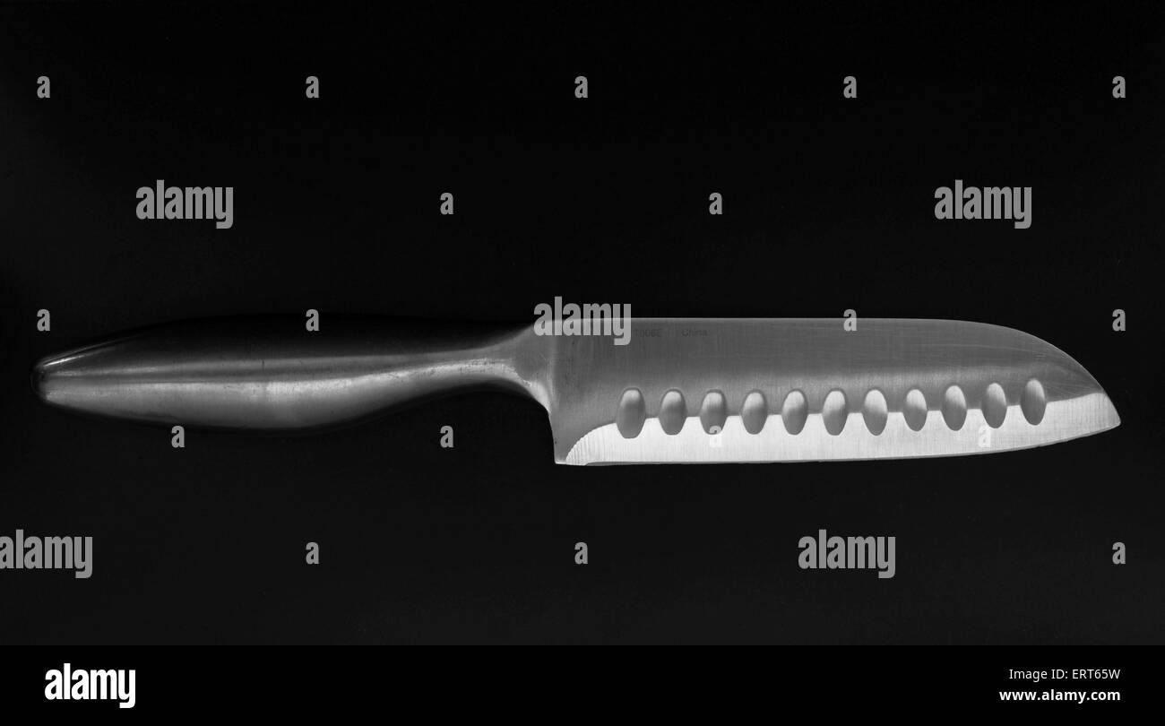 Sharp Kitchen Knife on Dark Background Stock Photo