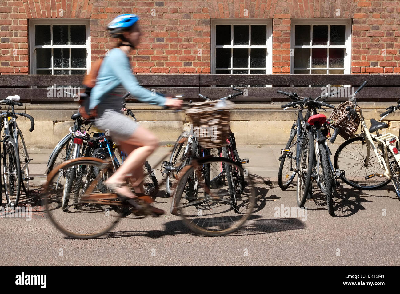 single female cyclist on street in cambridge, england Stock Photo - Alamy