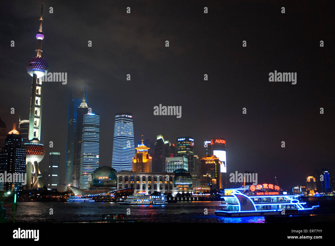 Pudong Skyline by night, Shanghai, China. Skyline of Pudong as seen from the Bund, with landmark Oriental Pearl tower and Jin Ma Stock Photo