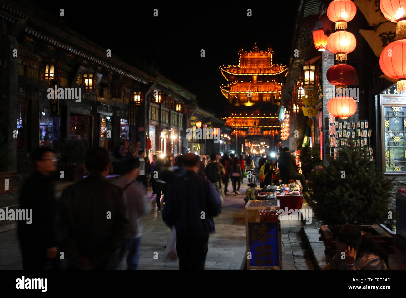 Bright night lights of the ancient Chinese city of Pingyao. China Stock Photo