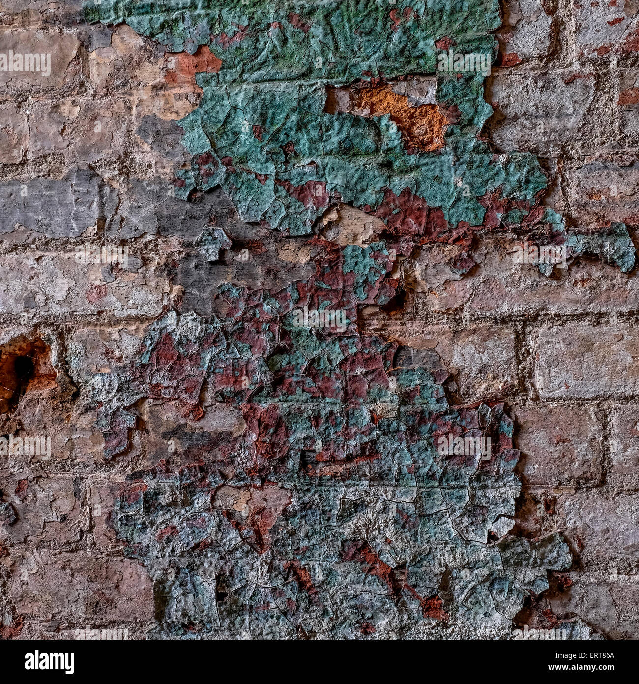 Paint peeling on an old mill wall which has been neglected over the years Stock Photo