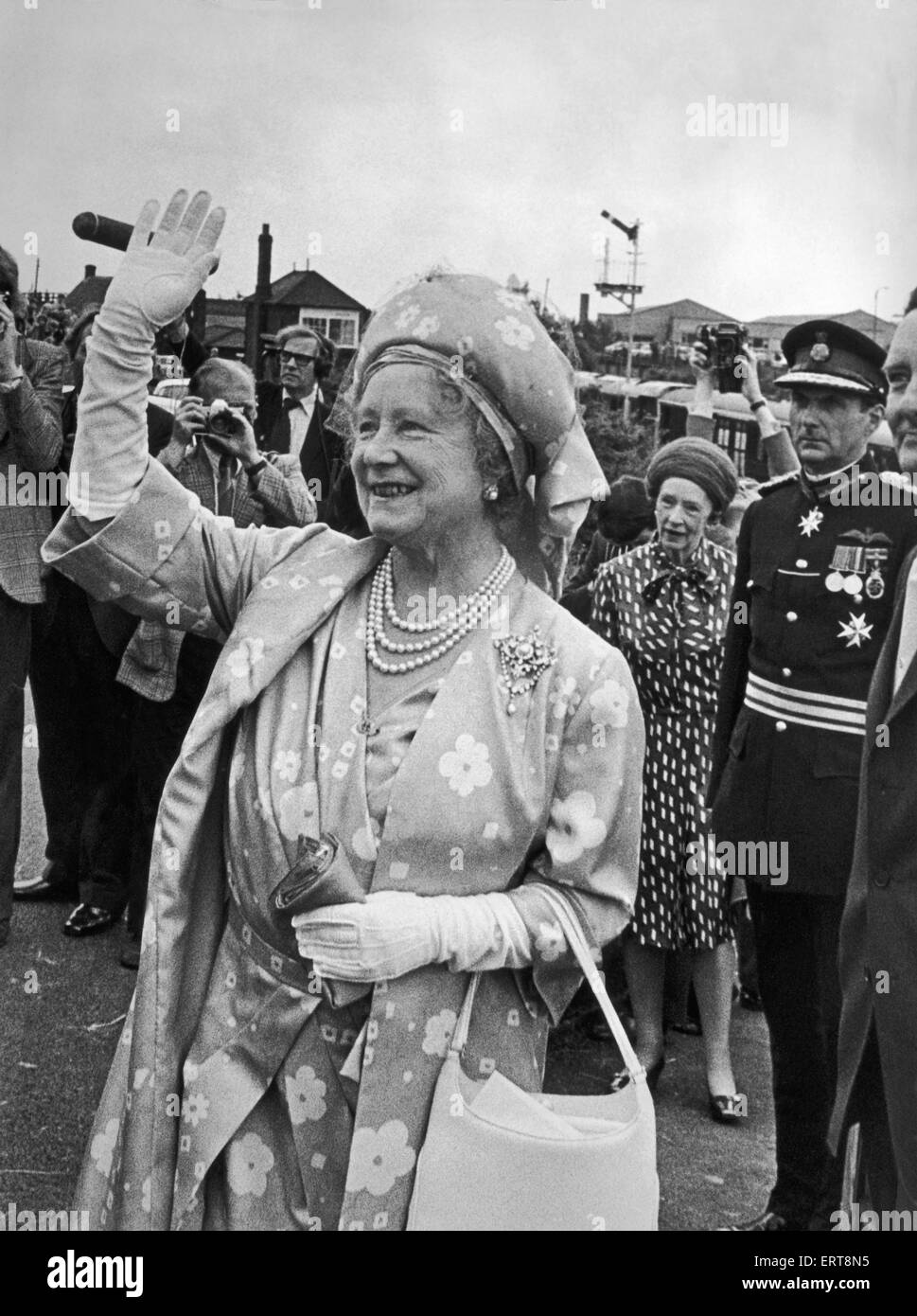 Elizabeth The Queen Mother waves to the cheering crowds at Shildon. She ...