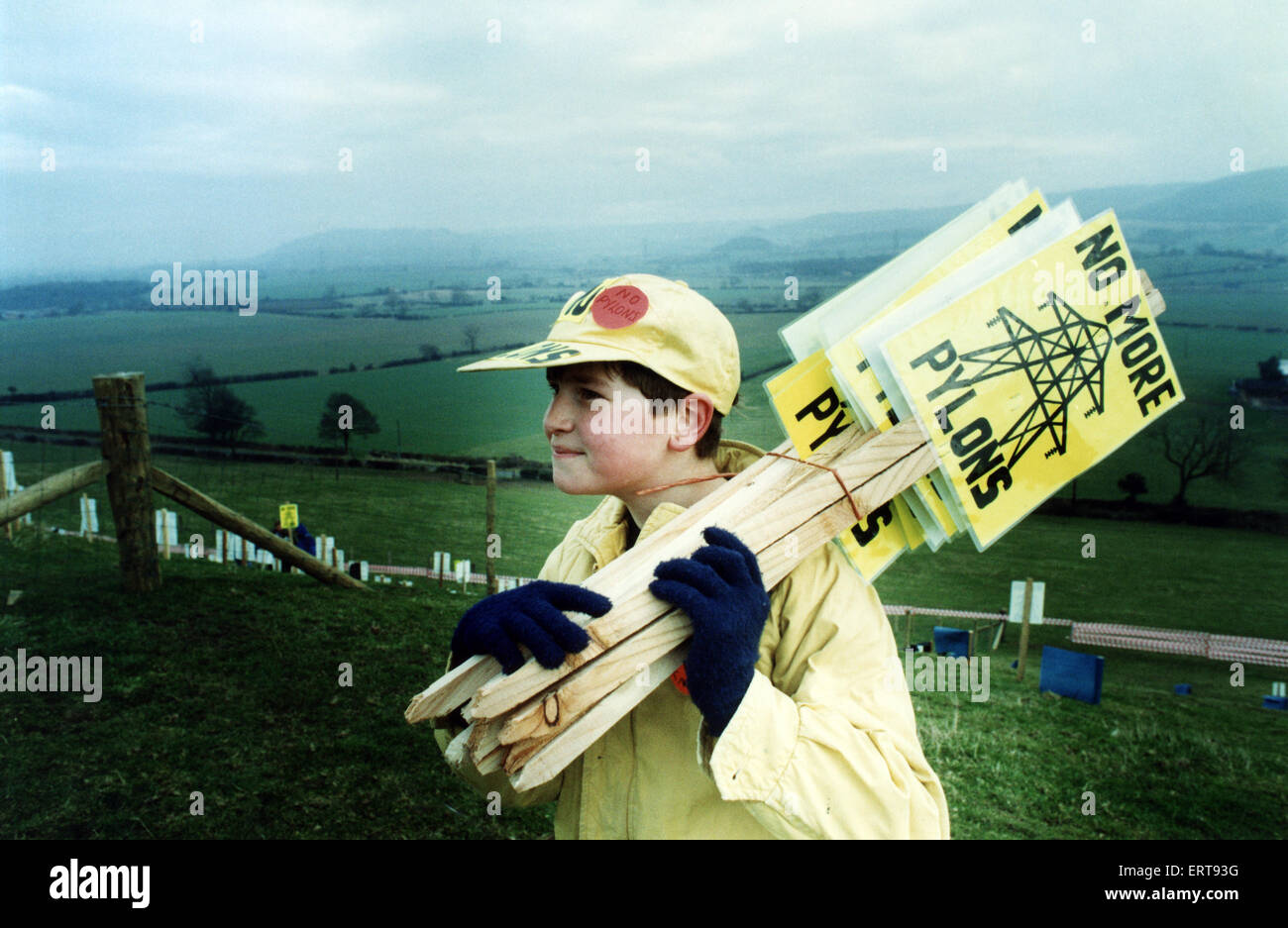11-year-old Josh Coe of Borrowby, carries more placards to the hillside at Beacon Hill, Kirby Sigston. The placards read 'No More Pylons' and are part of the Borrowby Pylon Action Group's plan to draw attention to National Grid's plans to route 400kv lines on pylons 150ft high across Cleveland and North Yorkshire. 26th February 1992. Stock Photo