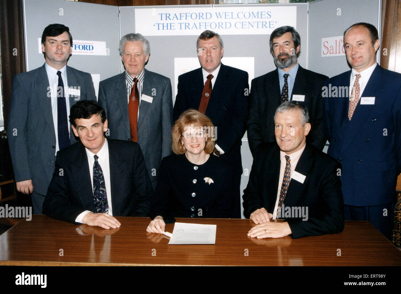 Signing of Construction Charter, for Trafford Centre, at Trafford Town Hall, Manchester, 16th October 1995.  Pictured. Beverley Hughes, Leader of Trafford Council, flanked by Robert Hough (left), Chairman of Manchester Ship Canal Company, and Dennis Bate, MD of Bovis North, with other officials. The Trafford Centre, a large indoor shopping centre and leisure complex in Dumplington, Greater Manchester, England, was opened on 10th September 1998, and is the second largest shopping centre in the United Kingdom by retail size. Stock Photo