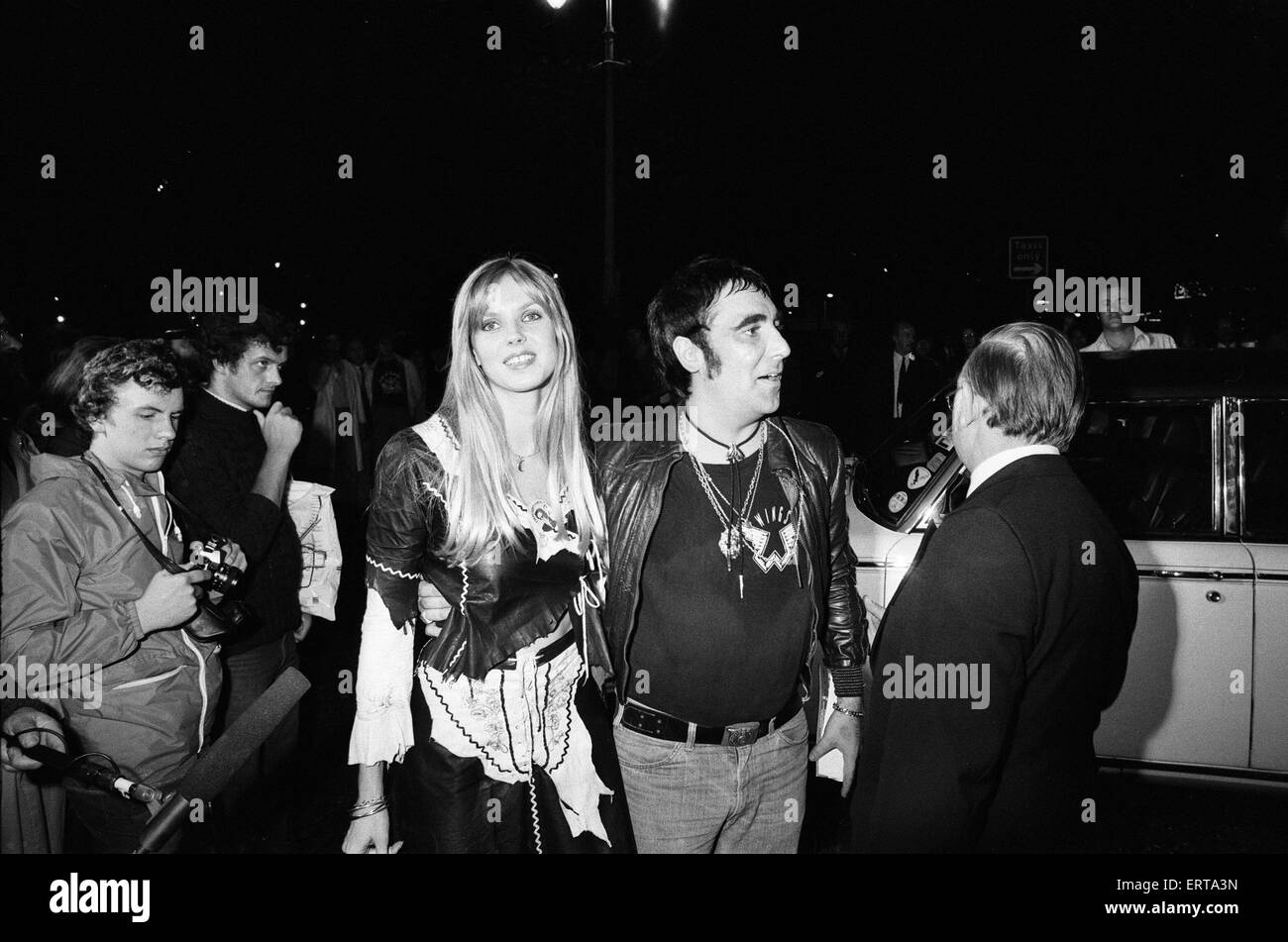 Keith Moon, drummer of the British rock group The Who, attending the  premier of the new film "The  Buddy Holly Story" in the West End with fiancee Annette Walter-Lax as guests of Paul and Linda McCartney. After dining with Paul and Linda at Peppermint Park in Covent Garden, Keith and Annette returned to their flat in Curzon Street, Mayfair where he was found dead early the next morning after overdosing on 32 tablets of clomethiazole, prescribed to Moon to alleviate his alcohol withdrawal symptoms.    6th September 1978. Stock Photo