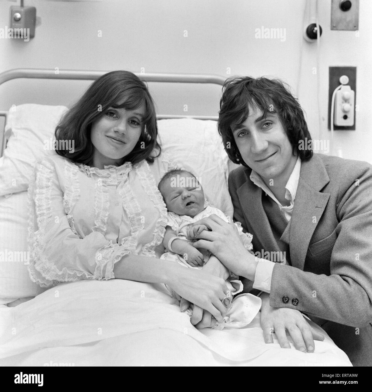 Pete Townshend of British rock group The Who with his wife Karen and their new born baby daughter at Queen Charlotte's hospital, London.  30th March 1969. Stock Photo