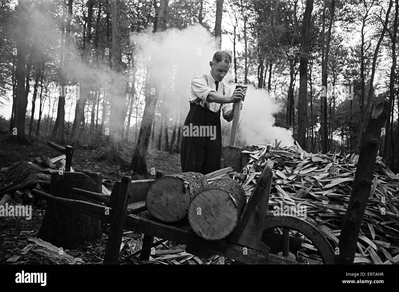 Chair bodgers working in West Wycombe, Buckinghamshire. Bodging is a traditional wood-turning craft used to make chair legs and other cylindrical parts of chairs. Circa 1945. Stock Photo