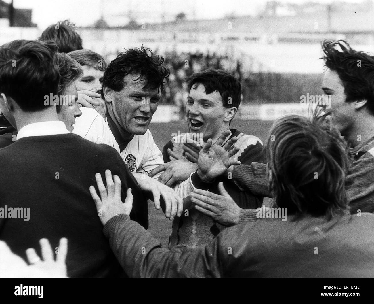Eddie Gray Leeds Manager mobbed by  fans after playing his last game for Leeds. Leeds United v Charlton Athletic, 12th May 1984. Stock Photo