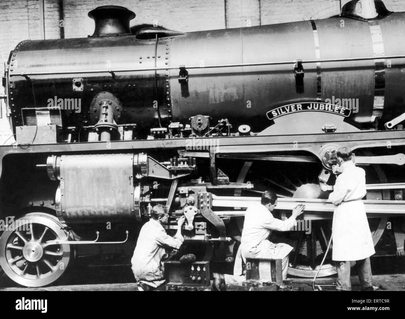 Workers chromium plating parts of the Silver Jubilee engine at Crewe LMS Works, April 1935. Stock Photo