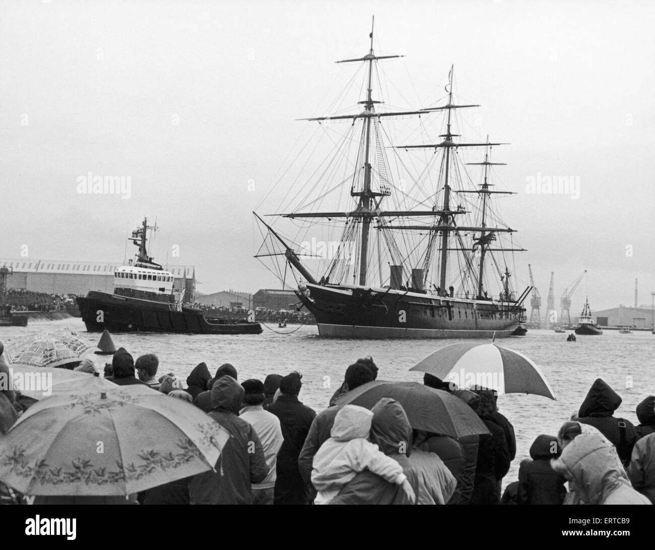 More than one hundred shipyard workers gathered at Hartlepool docks to bid farewell to the restored iron clad HMS Warrior. 12th June 1987 Stock Photo