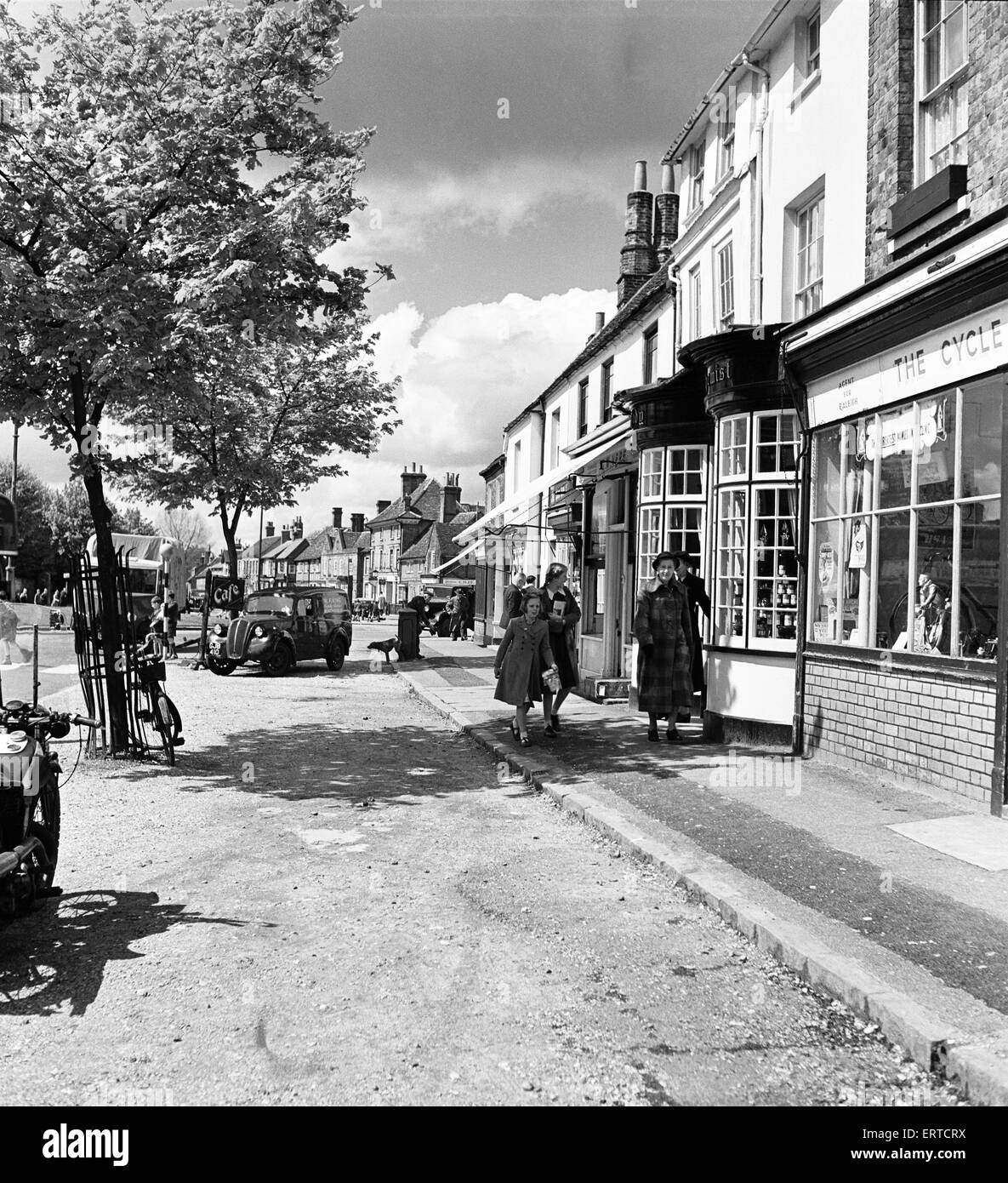 Street scene in Beaconsfield, Buckinghamshire. Women and young girls walking down the street. 7th May 1952 Stock Photo