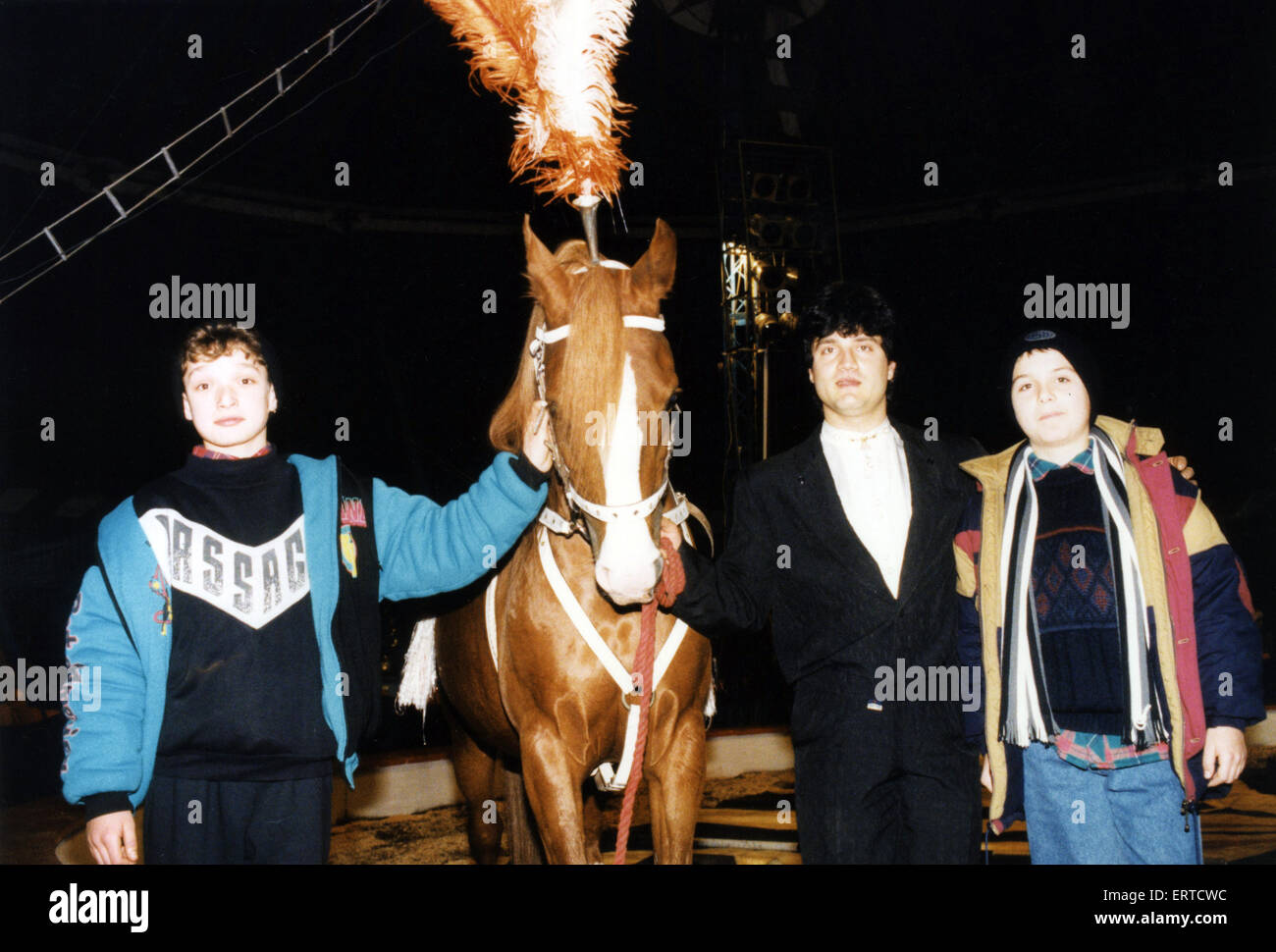 Two Romanian boys on an exchange visit to Middlesbrough schools. The two boys Daniel Iliescu and Alexandru Selim are pictured on a visit to the circus where they met fellow countryman Ionuts Ronescu who looks after the horses including Maril, in the picture. 5th January 1995. Stock Photo