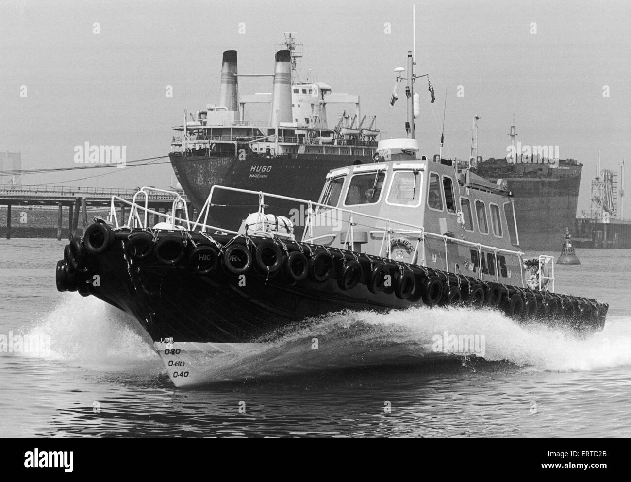 The new ¿315,000 Pilot Cutter High Force seen here on the River Tees with the tanker Hugo in the background. 26th June 1986 Stock Photo