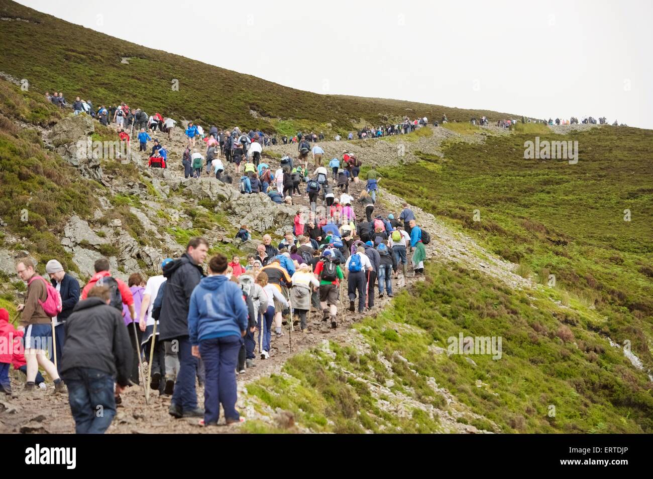 A woman climbing Croagh Patrick a holy mountain in County Mayo in the