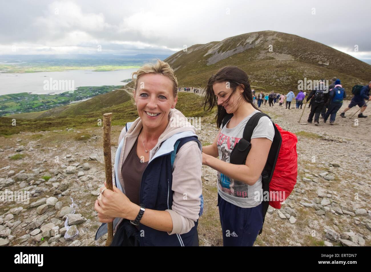 A woman climbing Croagh Patrick a holy mountain in County Mayo in the