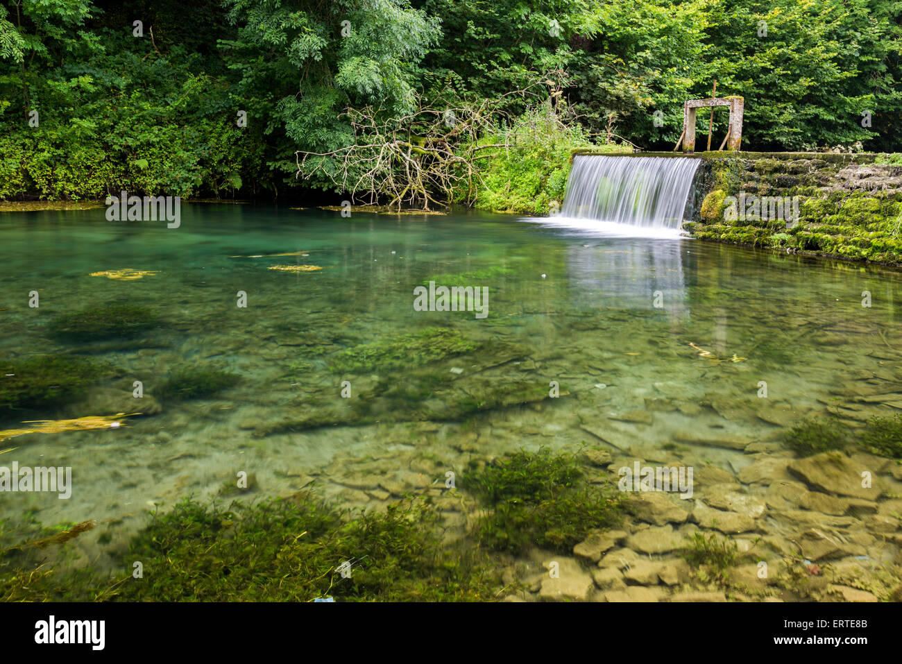 Small weir at Lathkill Dale National Nature Reserve in the Peak District National Park  Derbyshire Stock Photo