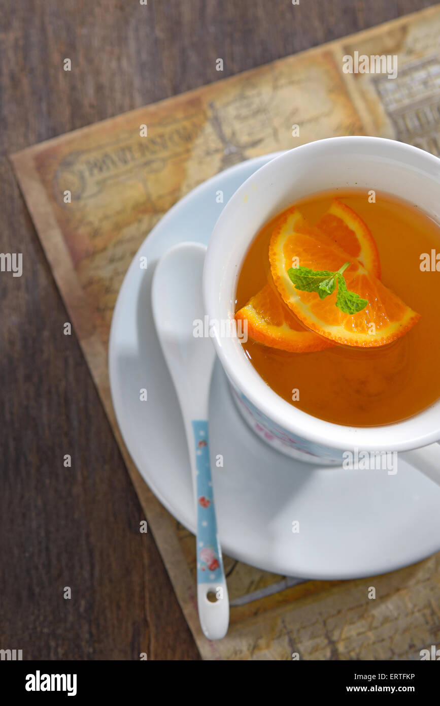 Tea with orange slices and mint leaves Stock Photo