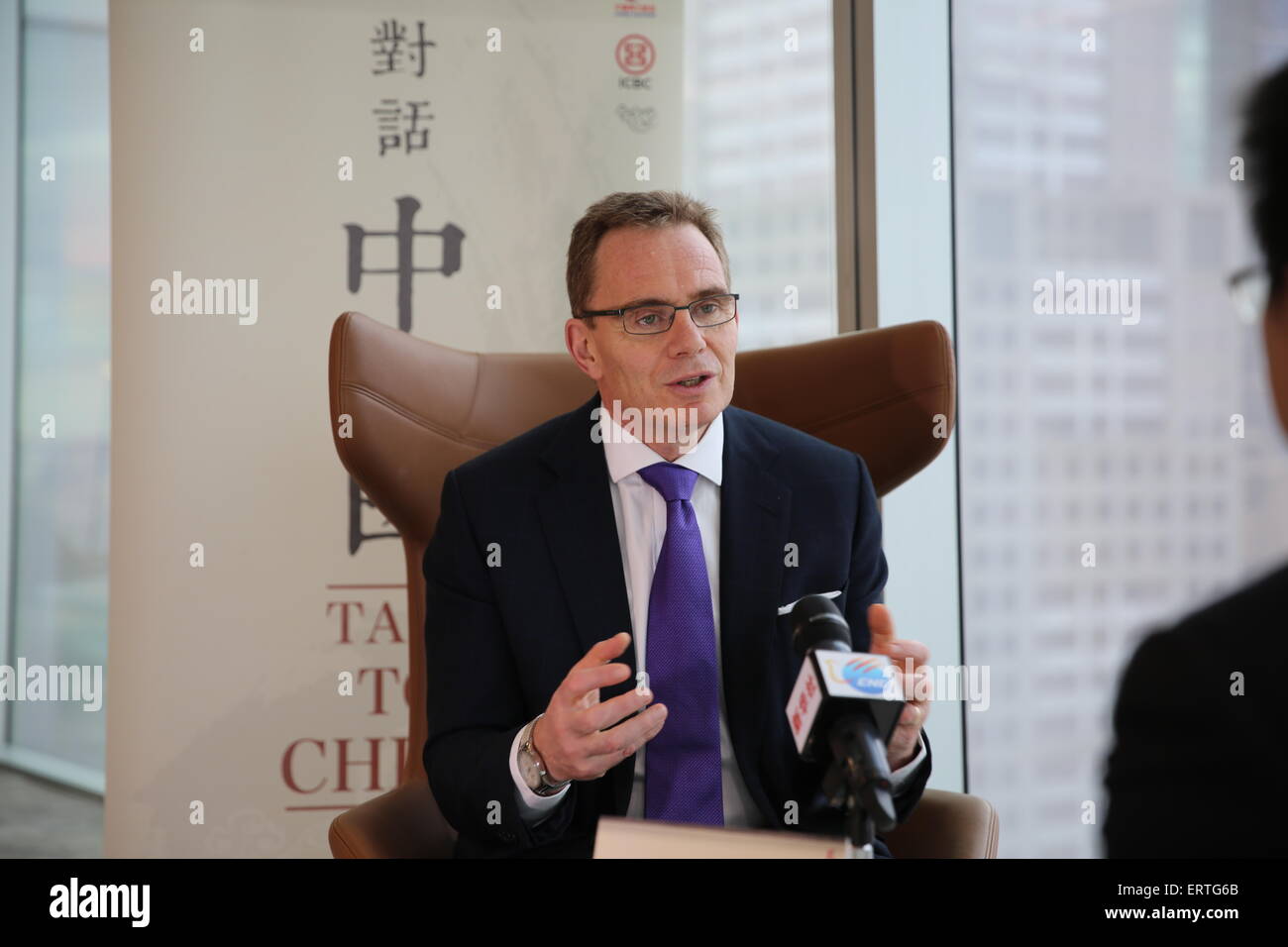 Sydney, Australia. 5th June, 2015. BHP Billiton Chief Executive Andrew Mackenzie receives an interview of China's Xinhua News Agency in Melbourne, Australia, June 5, 2015. BHP Billiton Chief Executive Andrew Mackenzie said on Friday in Melbourne that a number of measures are needed to make much more efficient use of fuels and decarbonize the energy supply. The interview was part of Xinhua's 'Talk To China' series discussions with leaders from various sectors of Australia with an aim to strengthen conversations between the two countries. © Li Bing/Xinhua/Alamy Live News Stock Photo