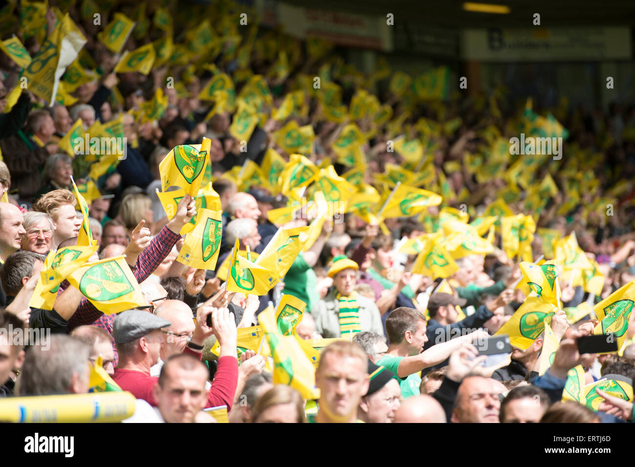 Norwich City Football fans wave flags during their Semi final second