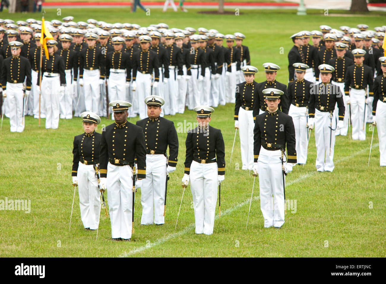 US Naval Academy cadets in formal dress stand at attention in the Color Parade at Worden Field on May 21, 2015 in Annapolis, Maryland. Stock Photo