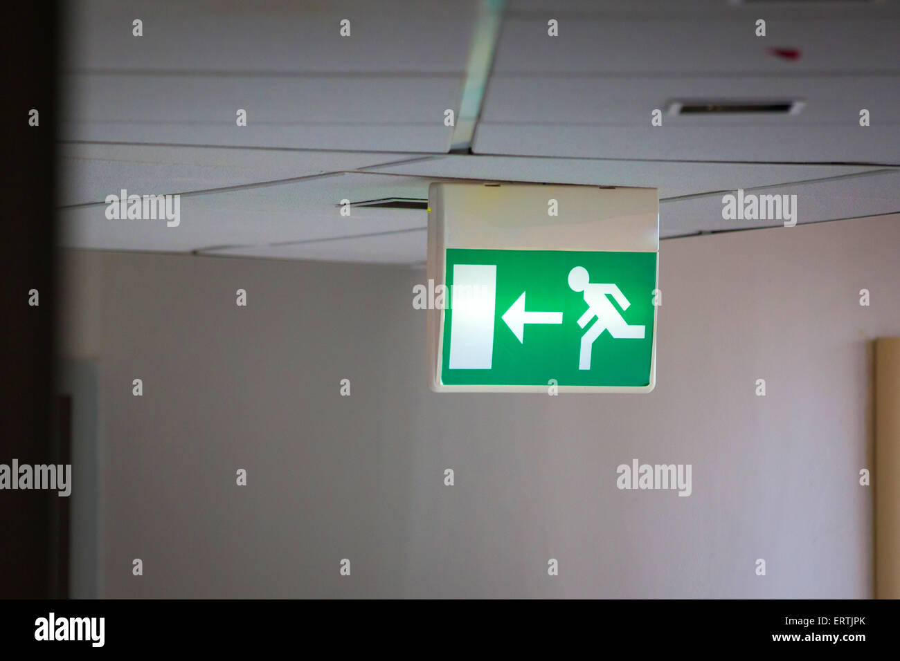 Emergency Exit Sign with Gray Background Stock Photo