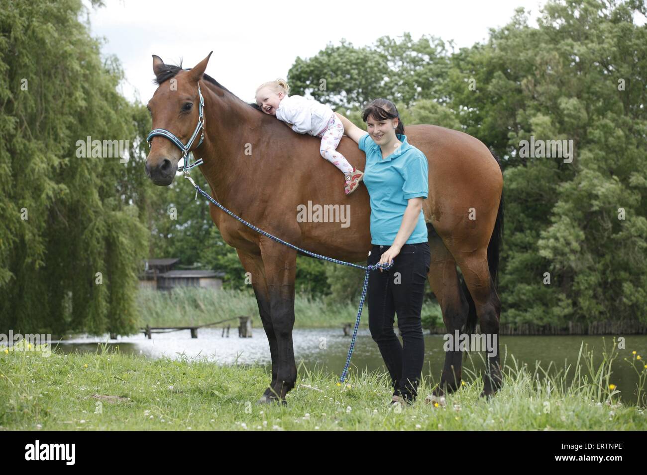 woman, child and warmblood Stock Photo