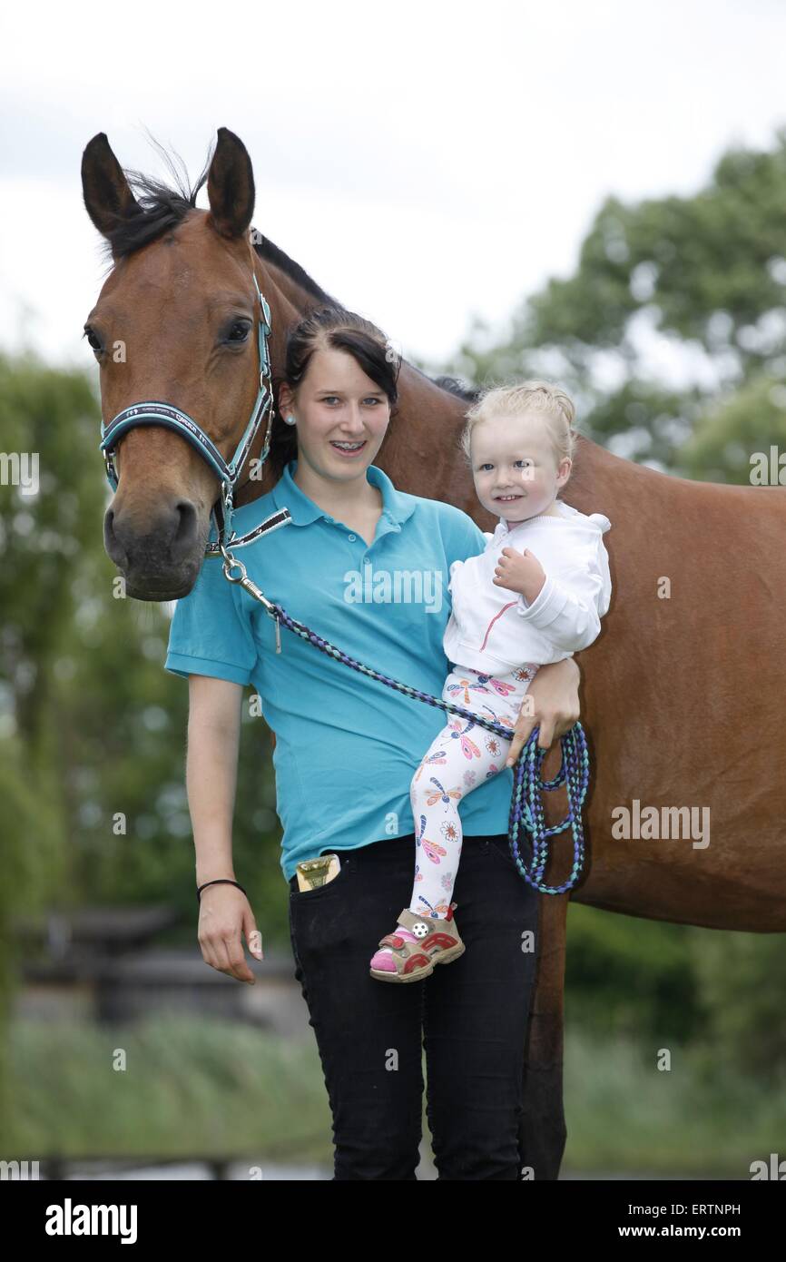 woman, child and warmblood Stock Photo