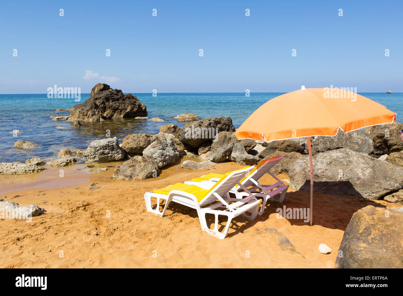 Beachbeds and Sunshade In San Blas Bay Gozo Malta Stock Photo