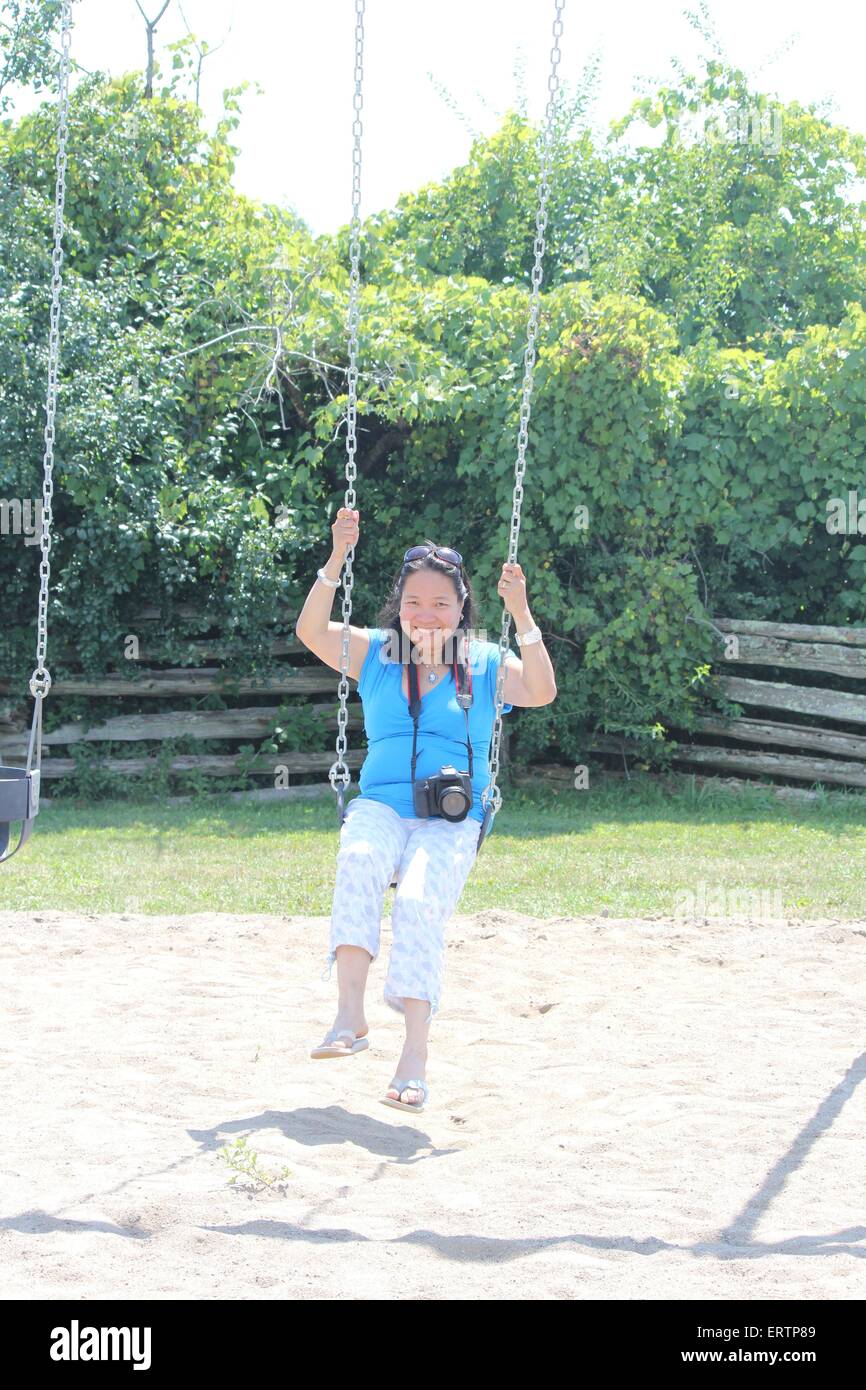Mature woman on swing hi-res stock photography and images - Alamy