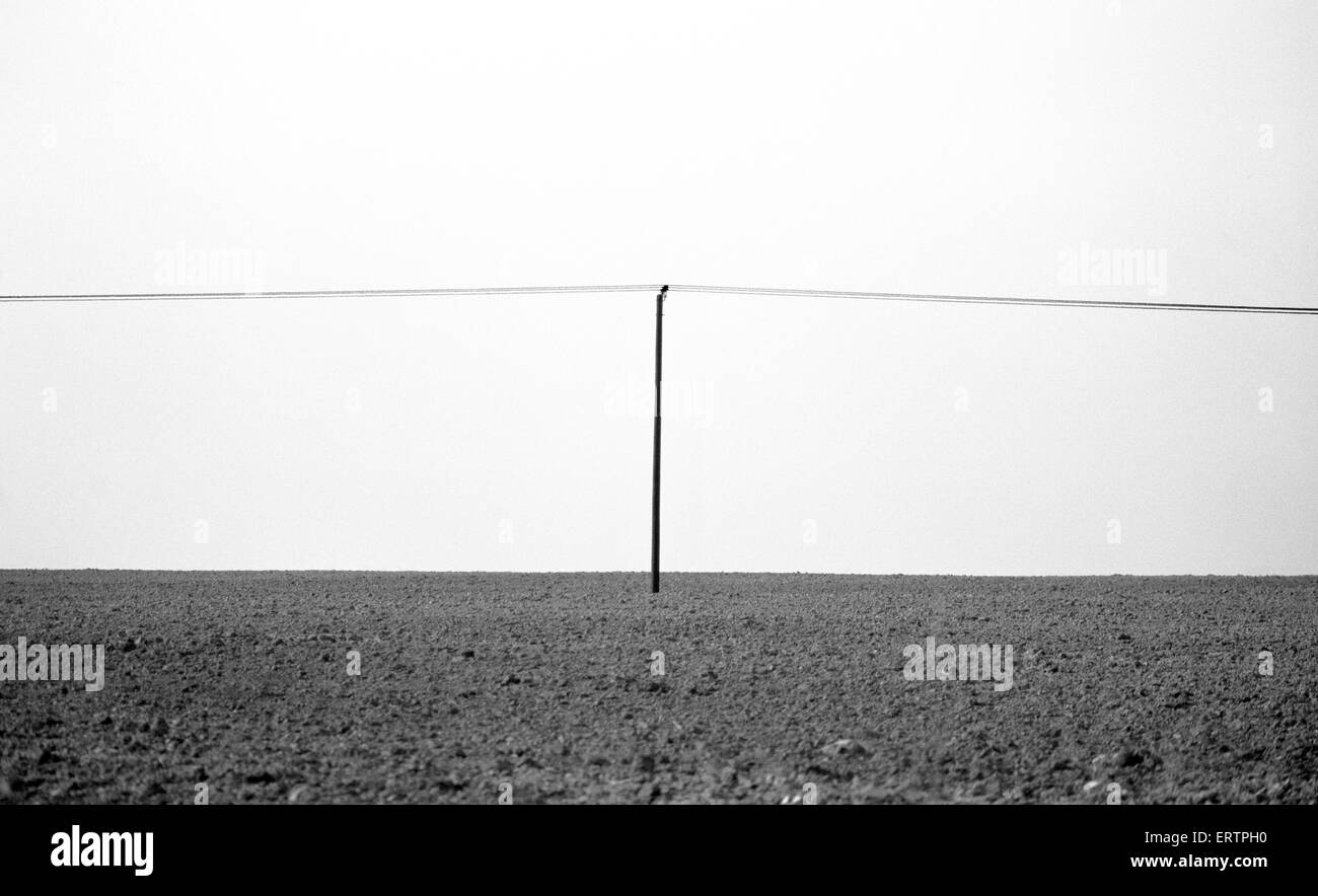 Electricity Pole in field Stock Photo - Alamy