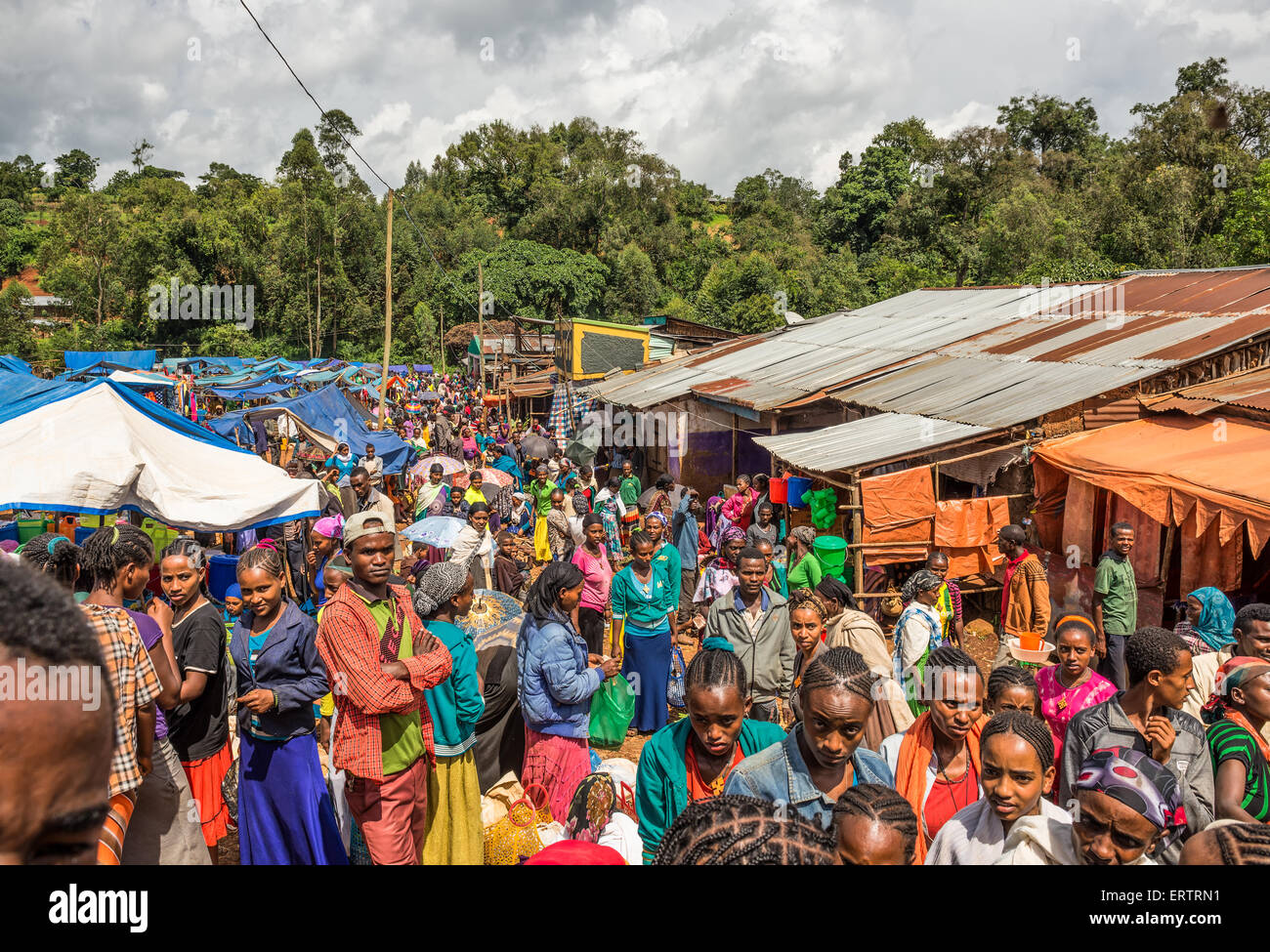 Popular and crowded african market in Jimma, Ethiopia with many  people buying and selling. Stock Photo