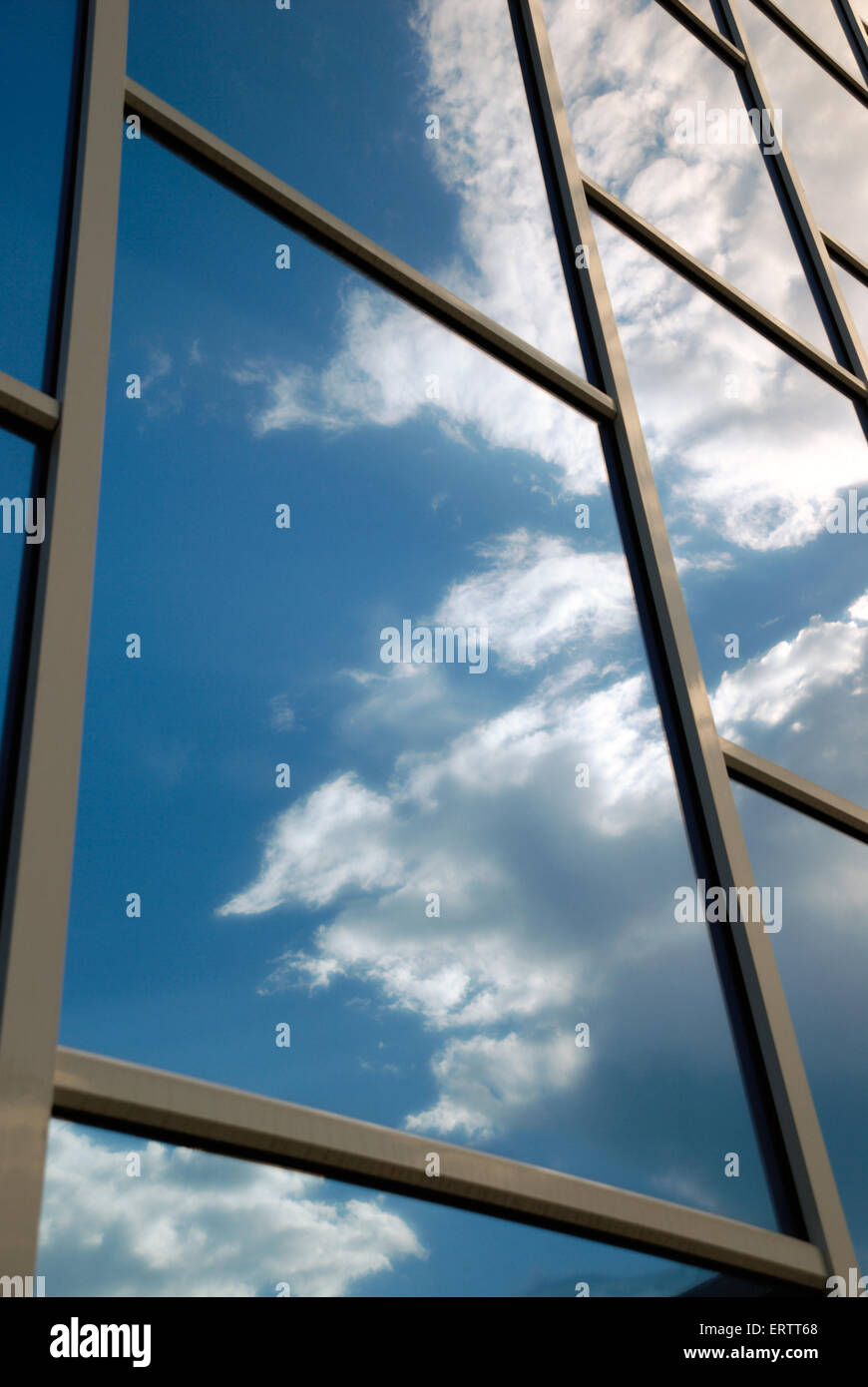 The facade of a modern building from blue glass reflects the sky Stock ...